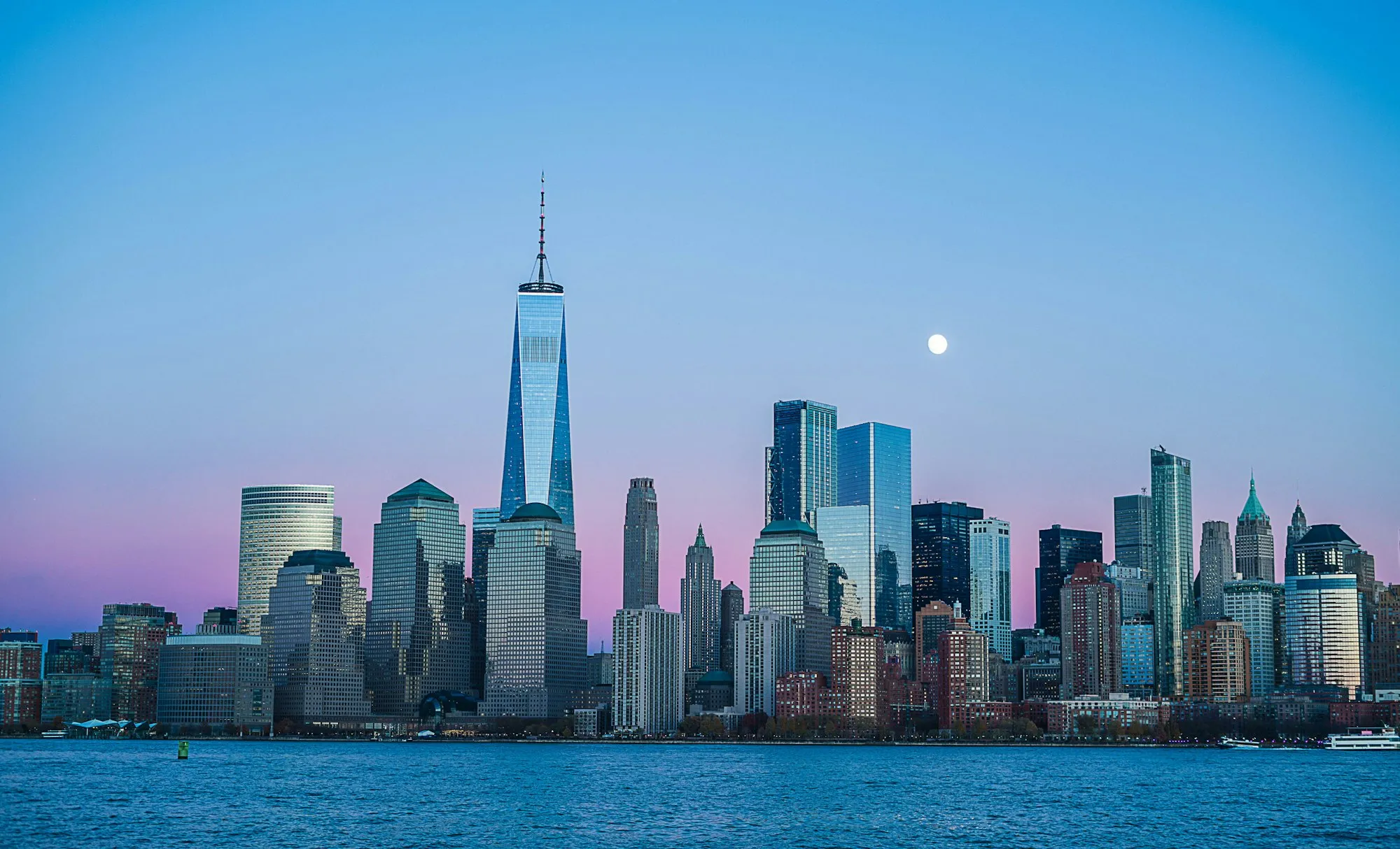 A sweeping downtown skyline — the cities and deals The Upleg covers.